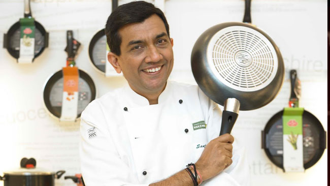 Table of Contents 1. Sanjeev Kapoor Net Worth 2. Awards and Recognition 3. Some Other Facts 4. Frequently Asked Questions Sanjeev Kapoor Net Worth is Rs 1000 Crore. We Indians love food. From eating at roadside stalls to restaurants, we like exploring a variety of food. Keeping this in mind, in this article we are going to discuss the India’s Celebrity Chef – Sanjeev Kapoor who made us fall in love with Food like no one did through his television shown ‘Khana Khazana’. Although Mr. Kapoor has no Michelin stars, still he’s a household name in India and enjoys a huge fan – base. In 1990’s, he was the new matinee idol for all his fans. Mr. Sanjeev Kapoor is an Indian Celebrity Chef, Entrepreneur, author and television personality. He was born on 10th April, 1964 in Kuralu, Haryana. He earned his diploma in Hotel Management from the Institute of Hotel Management, Catering & Nutrition, New Delhi. Sanjeev Kapoor Net Worth Today Sanjeev Kapoor’s business empire is valued at over Rs. 1000 Crores. Mr. Kapoor’s annual income is estimated to be around Rs. 25 Crores. So how he earns? His income depends on the earnings from his stake in Wonder Chef, through restaurant chains like his famous restaurant chain – ‘Yellow Chilly’, hosting TV Shows, brand endorsements and royalty earned from sale of his books. Name Sanjeev Kapoor Net Worth (2021) $140 Million Net Worth In Indian Rupees 1000 Crore INR Profession Chef Monthly Income And Salary 2.5 Crore + yearly Income 25 Crore + DOB 10 April 1964 Age 56 Years Place Ambala Spouse Alyona Kapoor (m. 1992) Social Account Instagram & Facebook Last Updated September 2021 Sanjeev Kapoor Net Worth He owns stake in Wonder chef, appliance brand which generates approx. Rs. 225 Crores annually. He owns restaurant chains in India, USA and Middle East which includes Signature by Sanjeev Kapoor, Khazana, Hong Kong, The Yellow Chilli, Sura Vie. The total revenue generated through restaurant chain is over Rs. 200 Crores. He has sold over 10 million cookery and recipe books which have generated around Rs. 80 Crores of revenue. His brand portfolio includes, Ariel, Dettol, Daawat Basamati Rice, Sleek Kitchen among others. He charges Rs. 30 to Rs. 40 lacs for each brand endorsement. He owns food channel – FOOD FOOD and host the shows – Cook Smart and Secret Recipes with Sanjeev Kapoor. The channel generates over Rs. 50 Crores annually. Range of pickles, blended spices, gourmet chutneys and ready to eat mixes under the brand name Khana Khazana, also fetch him huge amount of royalties. Making his presence felt on television, books and through restaurants, we can imagine that his net worth will always be growing. Mr. Sanjeev Kapoor worked in many hotels before he became the Executive Chef of the Centaur Hotel in Mumbai. He hosted the longest running cookery show of Asia, KHANA KHAZANA which bought him into the limelight. He has also ventured into the business of premium cookware and appliances and has launched his own 24 hour food TV Channel FOOD FOOD. Awards and Recognition He has received – Padma Shri, the fourth highest Indian National Honor in 2017. He has received ITA Award for Popular Chef and Entrepreneur (Zaika – E – Hind) in 2015. ITA Award for Best Cookery Show for Khana Khazana in 2002, 2004 and 2010. He has also created Guinness World Record by making 918 Kgs of Khichdi in front of live audience, in 2017. He was flown to Abu Dhabi in 2015 to prepare vegetarian meal for Prime Minister Narendra Modi. He was also included by Forbes in Forbes India Celebrity 100 List, ranking 34 in 2017 and ranking 73 in 2016. Sanjeev Kapoor Net Worth Some Other Facts As per Kapoor’s kitchen rule, he doesn’t want to cook something he has already cooked earlier and the ingredients have to be of the best quality. He has his own YouTube Channel, Sanjeev Kapoor Khazana, which to date has 5 million subscribers. Hope Mr. Sanjeev Kapoor continues to serve the nation by continuously serving the nation!